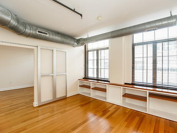 Hardwood floors are found throughout and oversized windows steam natural light into the property.