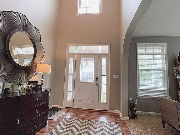Foyer with vaulted ceiling