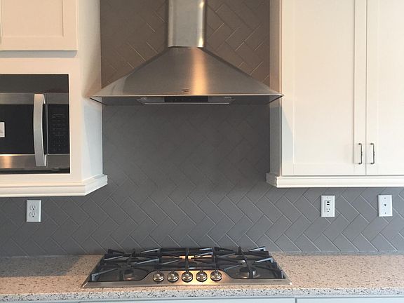 Gas stove with Italian-style hood