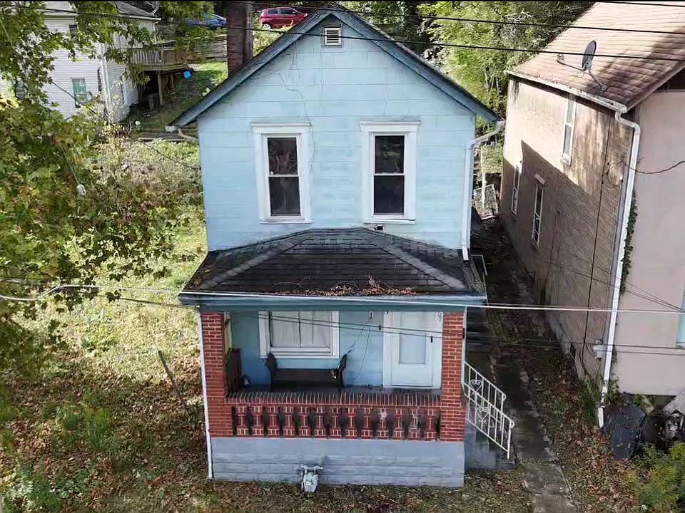 Front view of home closed in porch