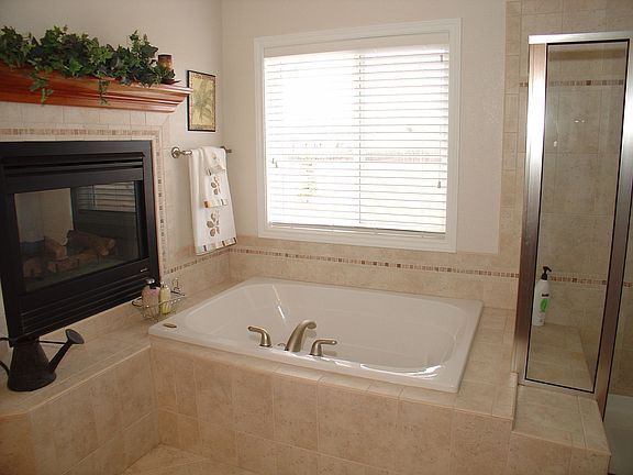 Double-sided fireplace in master