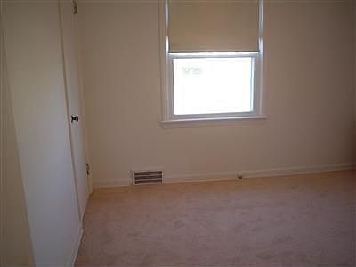 FIRST FLOOR BEDROOM WITH TWO WINDOWS, FRESHLY PAINTED AND NEW CARPET.