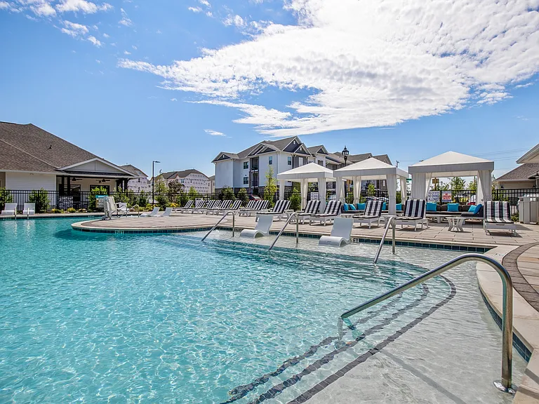 Sparkling Pool Area with Sun Deck