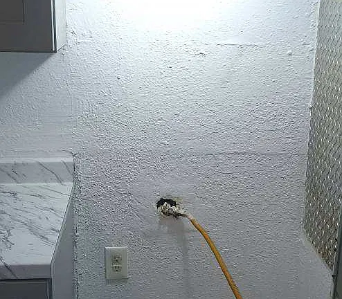 Interior utility connection — apartment 2 at 3245 West Jefferson Apartments.