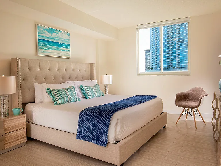 Spacious bedroom offering scenic views and natural light