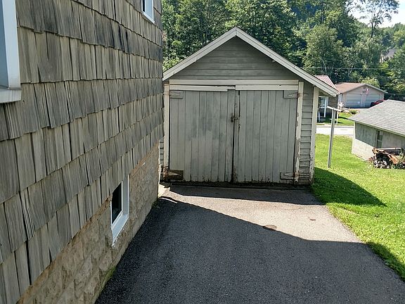 Shed and paved front driveway