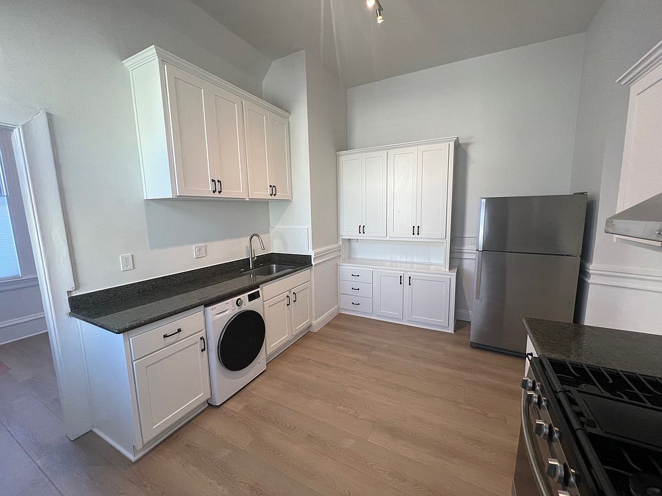 Newly remodeled kitchen with combo washer/dryer