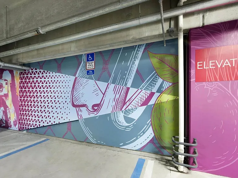 Vibrant Urban Artwork in Anchor Riverwalk Parking Structure Near Elevator Entrance