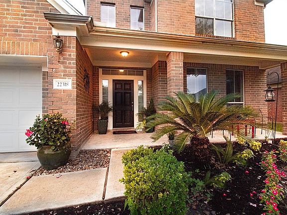 Beautiful entrance and front porch makes coming home easy. This beautifully landscaping is easy to care for.