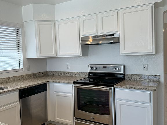 Kitchen area with view of appliances and cabinetry.