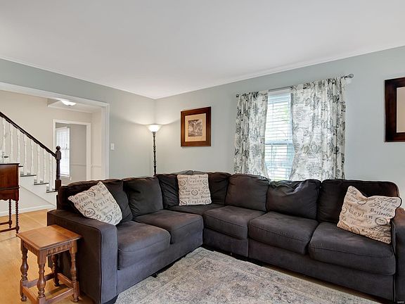 Formal Living bright and airy. Beautiful wood floors