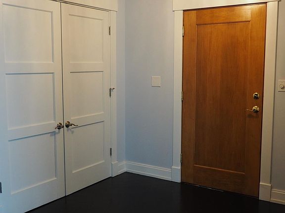Entrance, french door storage closets on both sides