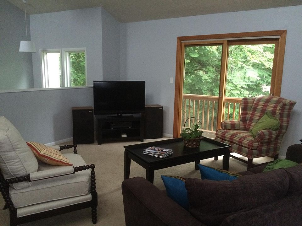 Vaulted living room with an abundance of natural light
