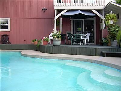 In-ground kidney shaped pool for entertaining.
