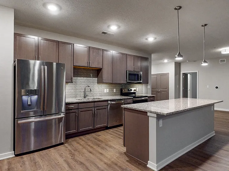 The 2-bedroom Hibiscus comes with a large kitchen with an open layout and abundant storage options.
