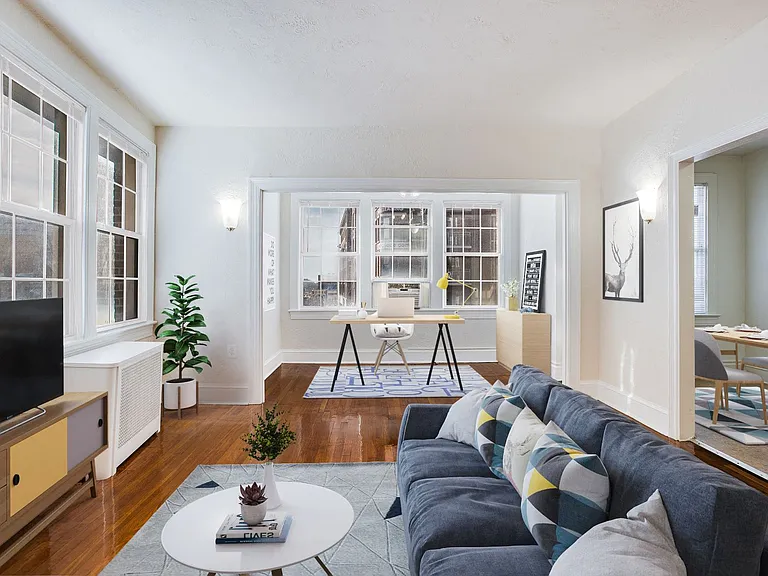 Living and sunroom (virtually staged)