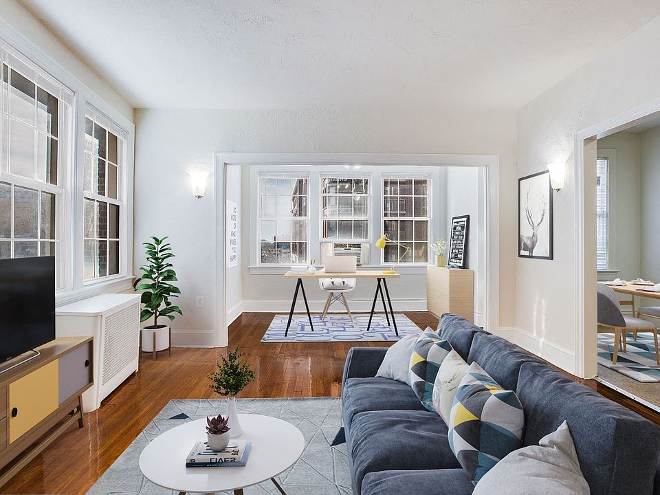 Living and sunroom (virtually staged)