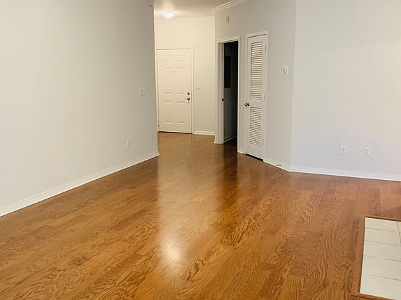 Open Floor plan with lots of light and hardwood flooring in living areas.