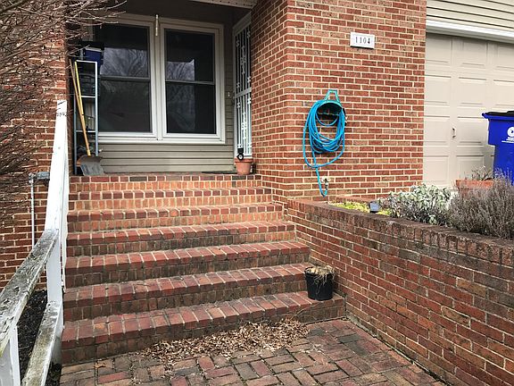 Front porch with perennial herb garden at R