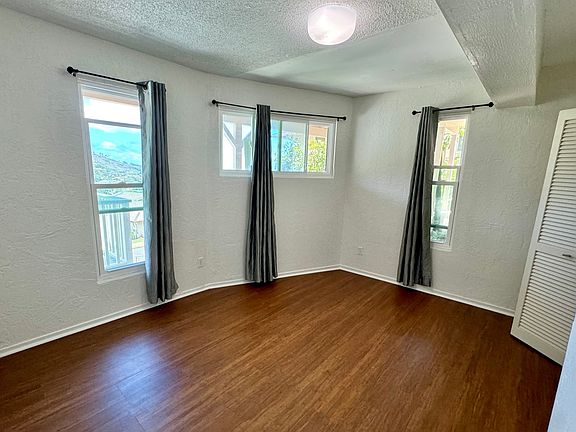 Actual unfurnished bedroom and closet, sits apart from living room.