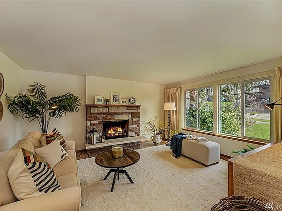 Living room area with wood burning fireplace