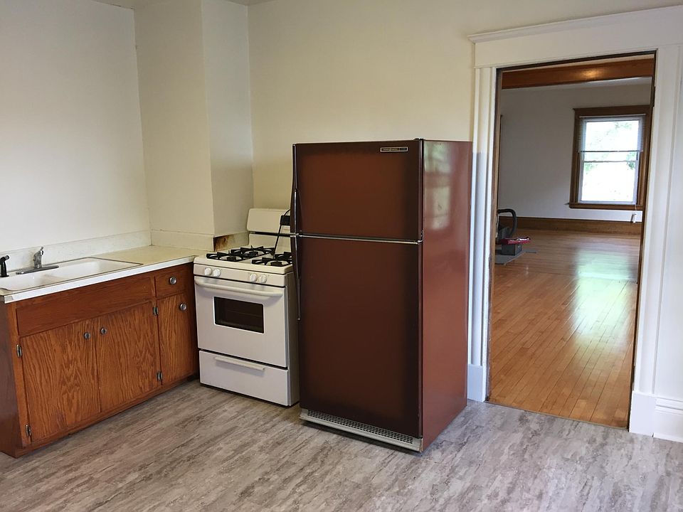 Kitchen with dining room and living room in background