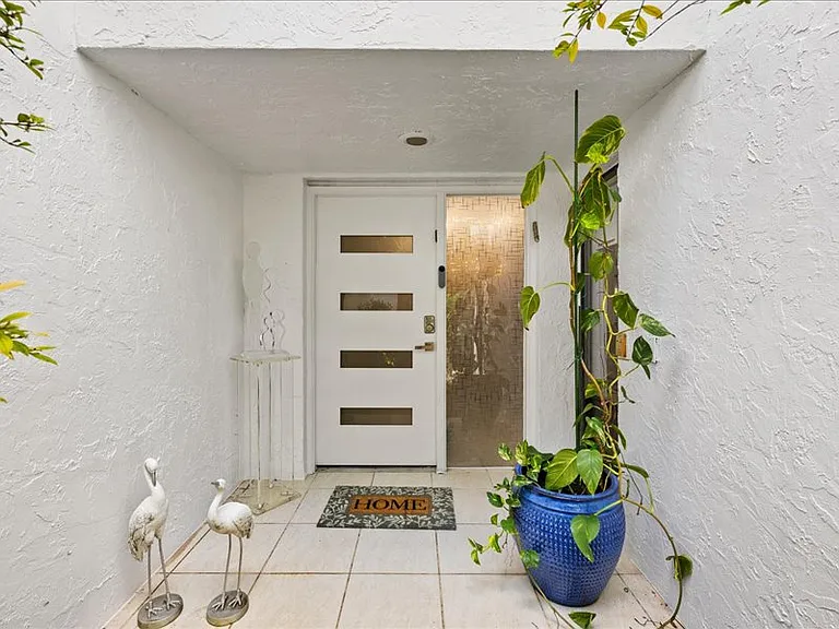 Front entrance with smart lock and ring door bell.