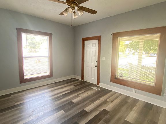 Living room w/ entrance door
