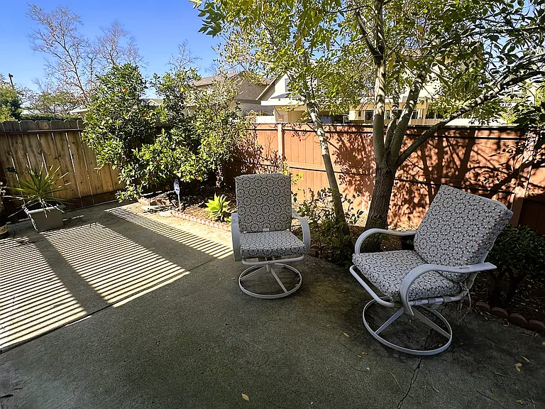 Enjoy direct access to the backyard through the room's sliding door.