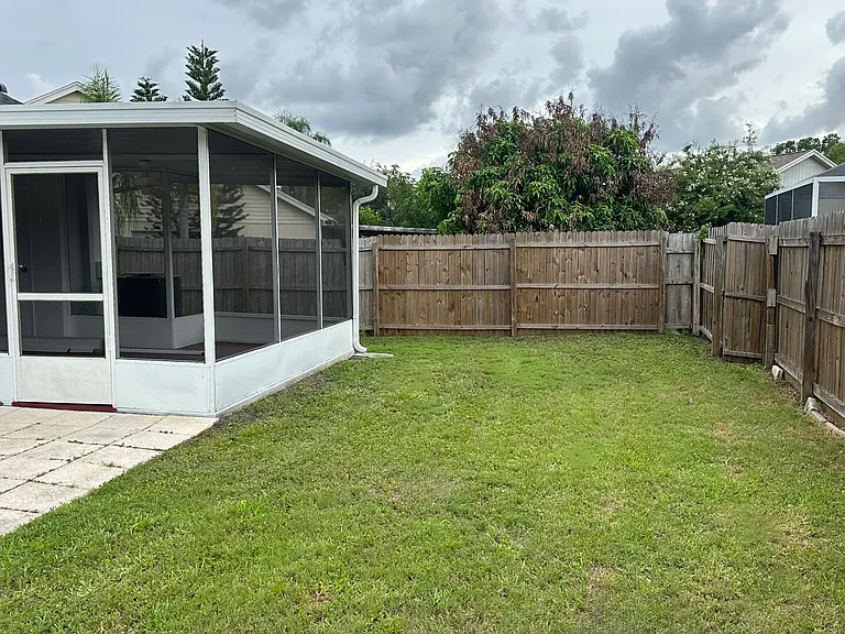 Fenced in backyard for your kids to play or dog to run around in.