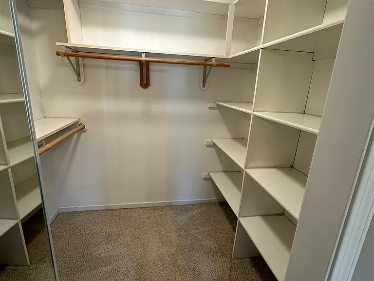Full closet for primary bedroom.