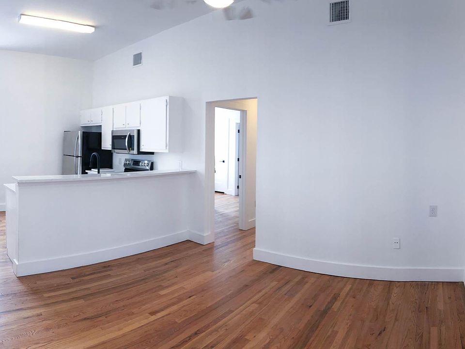 living area / kitchen has two 6.5' windows and hardwood floo