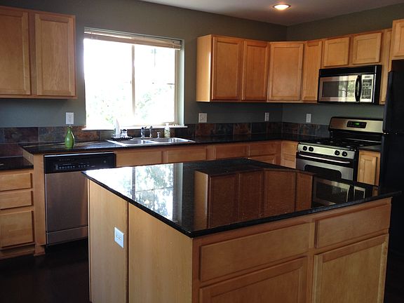 Kitchen, island has additional storage and counter space