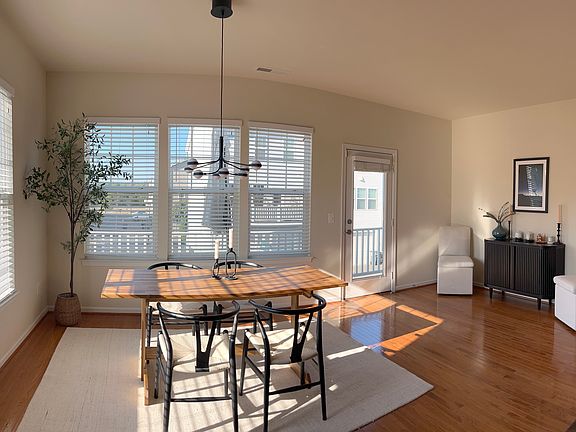 Sun-filled dining room with a bar area + an attached outside deck.