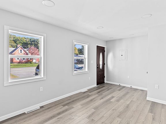 Front entrance into bright living room
