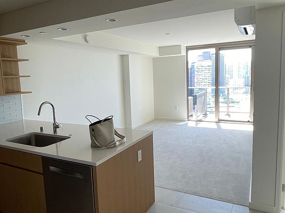 Facing towards Diamond Head, kitchen on the left in front is the living room and then I'll walk out Lanai