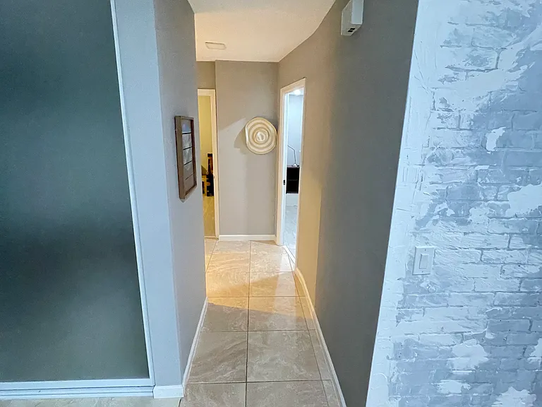 Hallway to guest bath, and both bedrooms