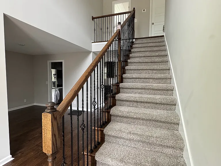 Front Entryway:
* Formal dining room/kitchen (left)
* Upstairs: primary bedroom (left) laundry (right)