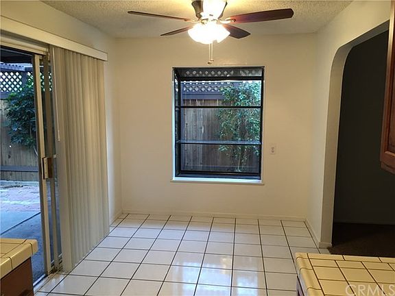 Kitchen view into dining area & garden window.