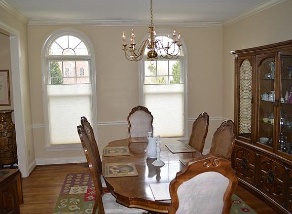 Dining Room w/ Hardwood Floors, Crown Molding