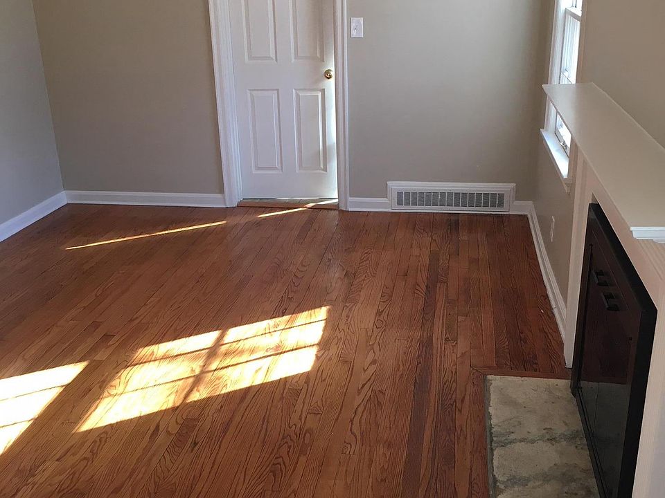 One of the two living rooms . Behind the white door is an extra room that could be used as an office or study.
