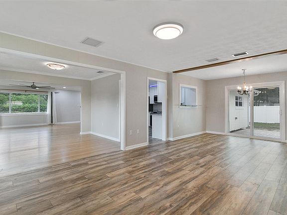 Family Room / Den / MultiPurpose Area with breakfast nook, provides a welcoming charm when entering from the side carport area, a little less formal, more cozy casual, large sliding doors with mini blinds inside the glass for easy care and cleaning. Enjoy