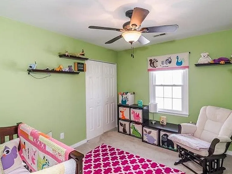 Bedroom with closet. Window faces side of the house.