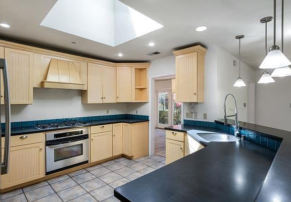 Kitchen with Sky light Fridge Freezer, Oven, Dishwasher, gas cook top