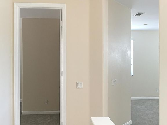 Standing at the upstair hallway looking at bedroom #2 suite 