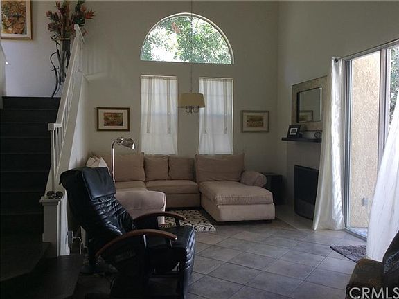 Living Room has vaulted ceilings to the roofline and celestial windows, cozy fireplace, extra tall s