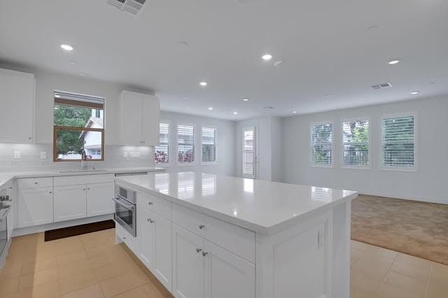 Open area, kitchen and living room.