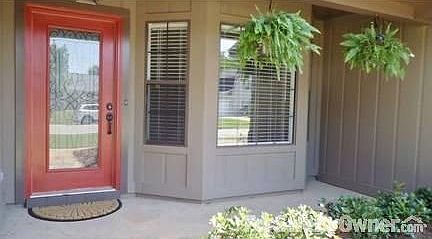 Front porch
						:
						New front door features decorative scroll inset.