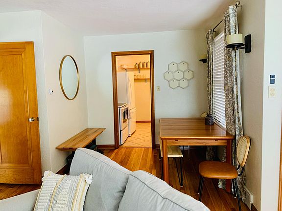 The table extends to offer additional seating and there are thoughtful picture frames throughout the home for renters to add a personal touch with their own photos, postcards, notes, etc.