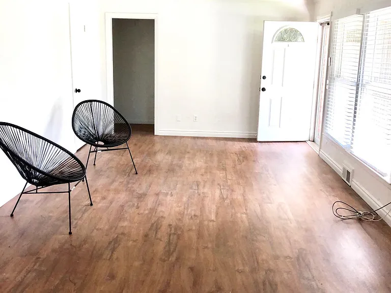 Open plan living & dining rooms. New vinyl flooring and lighting. 2" blinds throughout.